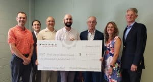 Large check presentation at NOrth Start of Chester County with Westfield and Arthur Hall Insurance reps